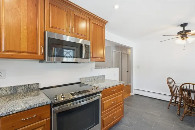 a kitchen with a stove and a microwave