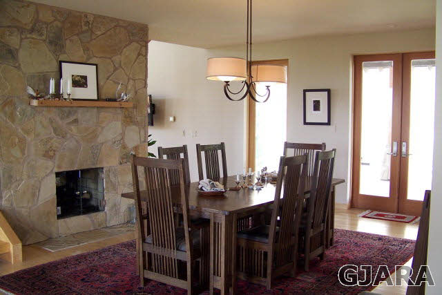 680 39 Road Palisade, CO 81526 - Photo 16 of 32 a view of a dining room with furniture window and wooden floor