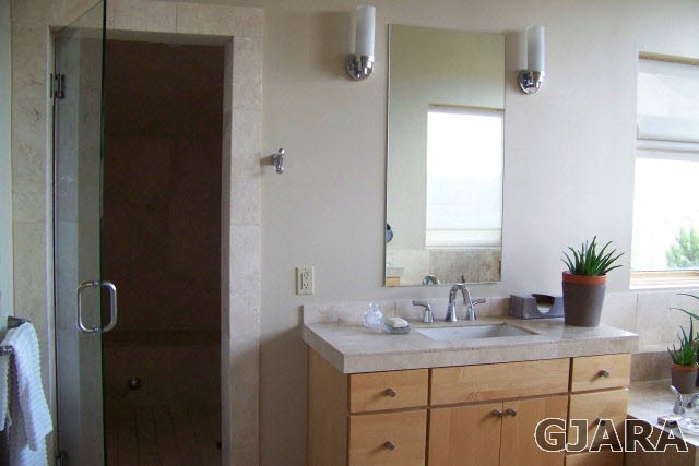 680 39 Road Palisade, CO 81526 - Photo 18 of 32 a bathroom with a granite countertop sink a mirror and a shower