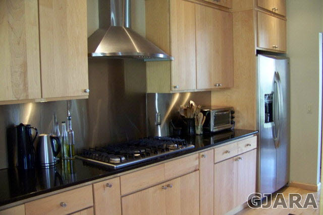 680 39 Road Palisade, CO 81526 - Photo 23 of 32 a kitchen with granite countertop a stove and a refrigerator