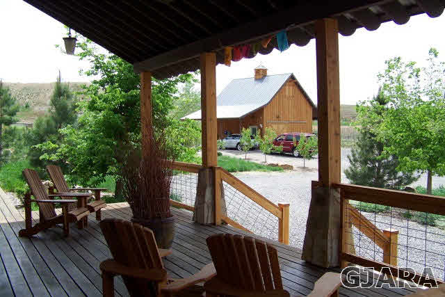 680 39 Road Palisade, CO 81526 - Photo 27 of 32 a view of a porch with furniture and wooden floor