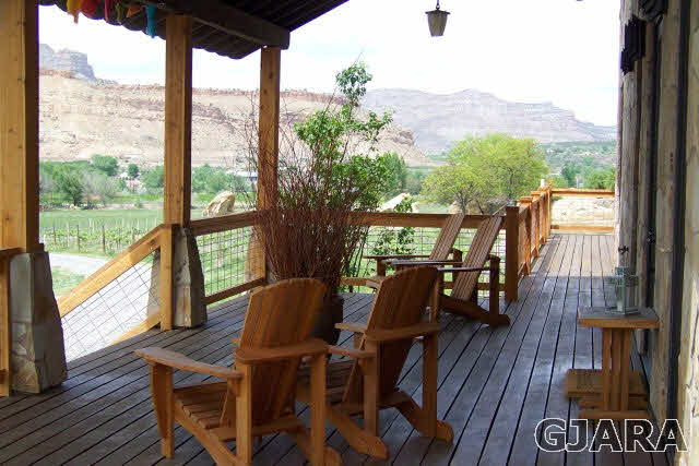 680 39 Road Palisade, CO 81526 - Photo 7 of 32 a view of a dining room with furniture window and wooden floor