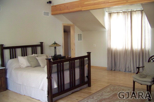 680 39 Road Palisade, CO 81526 - Photo 10 of 32 a bed room with a bed and a window