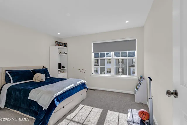 a utility room with furniture and window