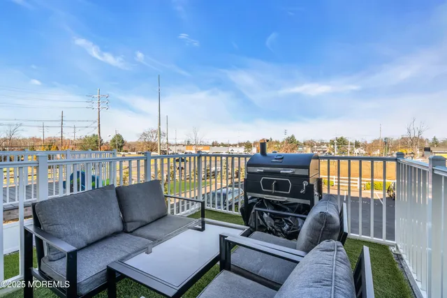 a front view of a house with sitting area and swimming pool