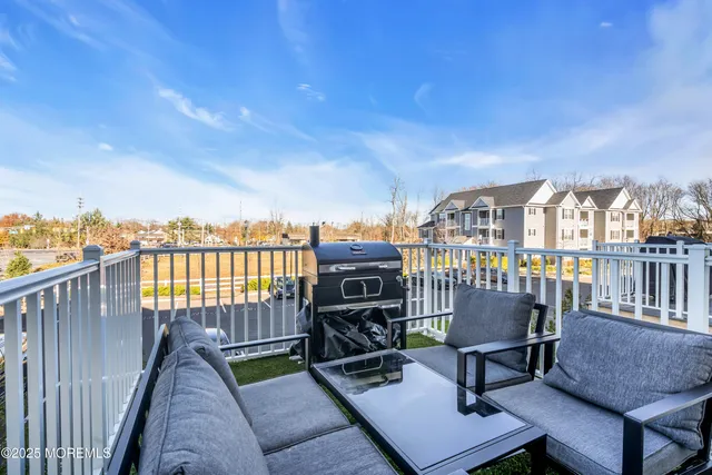 a view of a house with backyard sitting area and garden
