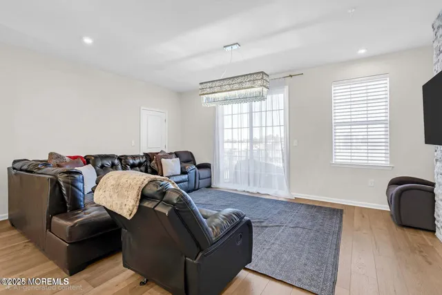 a large kitchen with kitchen island a dining table and chairs