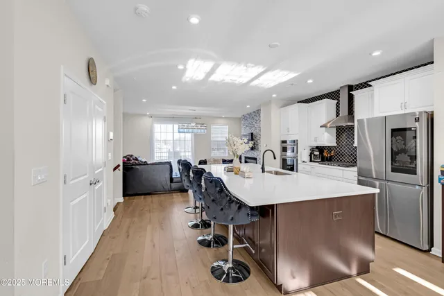 a view of a dining room with furniture and a flat screen tv