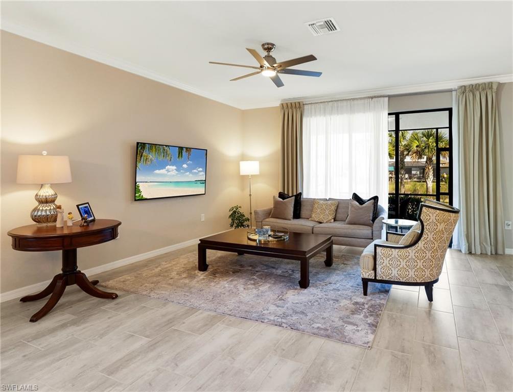 19724 The Pl Boulevard Estero, FL 33928 - Photo 18 of 36 a living room with furniture and a window