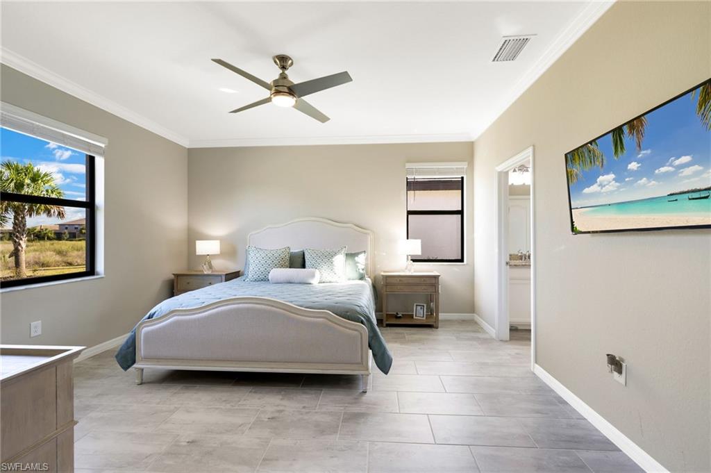 19724 The Pl Boulevard Estero, FL 33928 - Photo 24 of 36 a bedroom with a bed and window