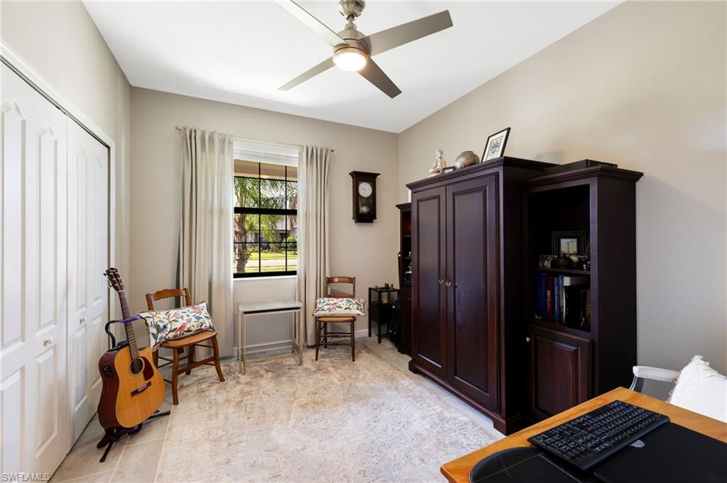 19724 The Pl Boulevard Estero, FL 33928 - Photo 32 of 36 a living room with furniture and wooden floor