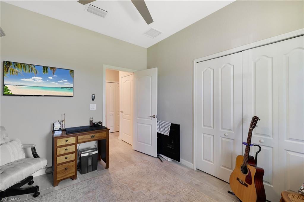 19724 The Pl Boulevard Estero, FL 33928 - Photo 33 of 36 a view of a workspace with furniture and a window