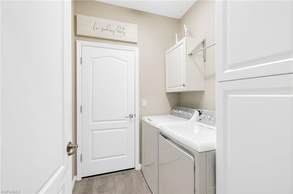 19724 The Pl Boulevard Estero, FL 33928 - Photo 9 of 36 a bathroom with a sink a toilet and shower