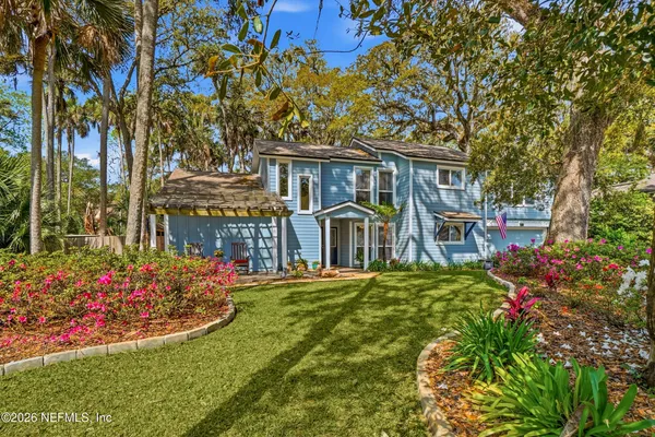 front view of a house with a small yard