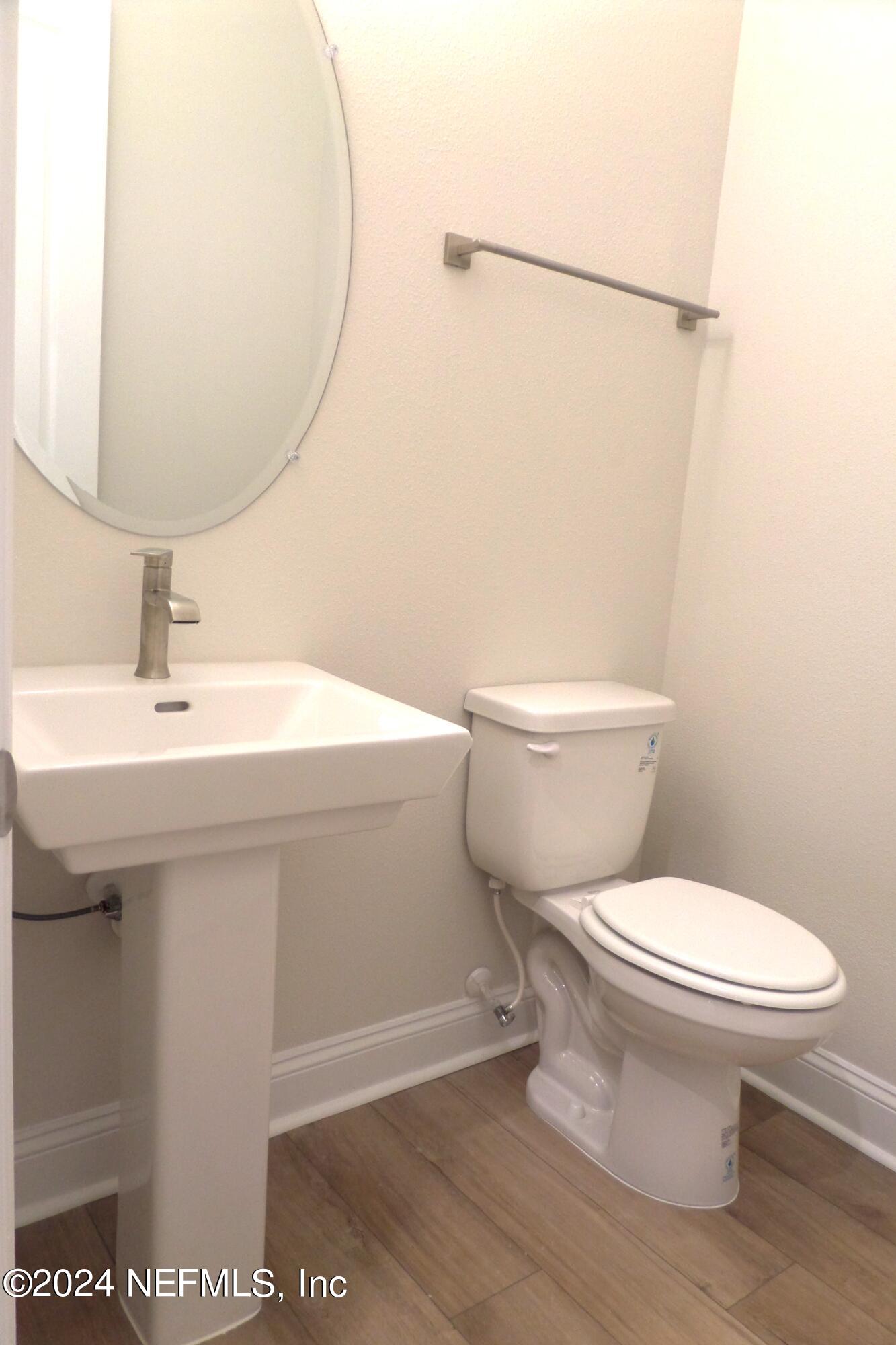 283 Pinellas Way St. Johns, FL 32259 - Photo 11 of 71 a bathroom with a sink toilet and a mirror