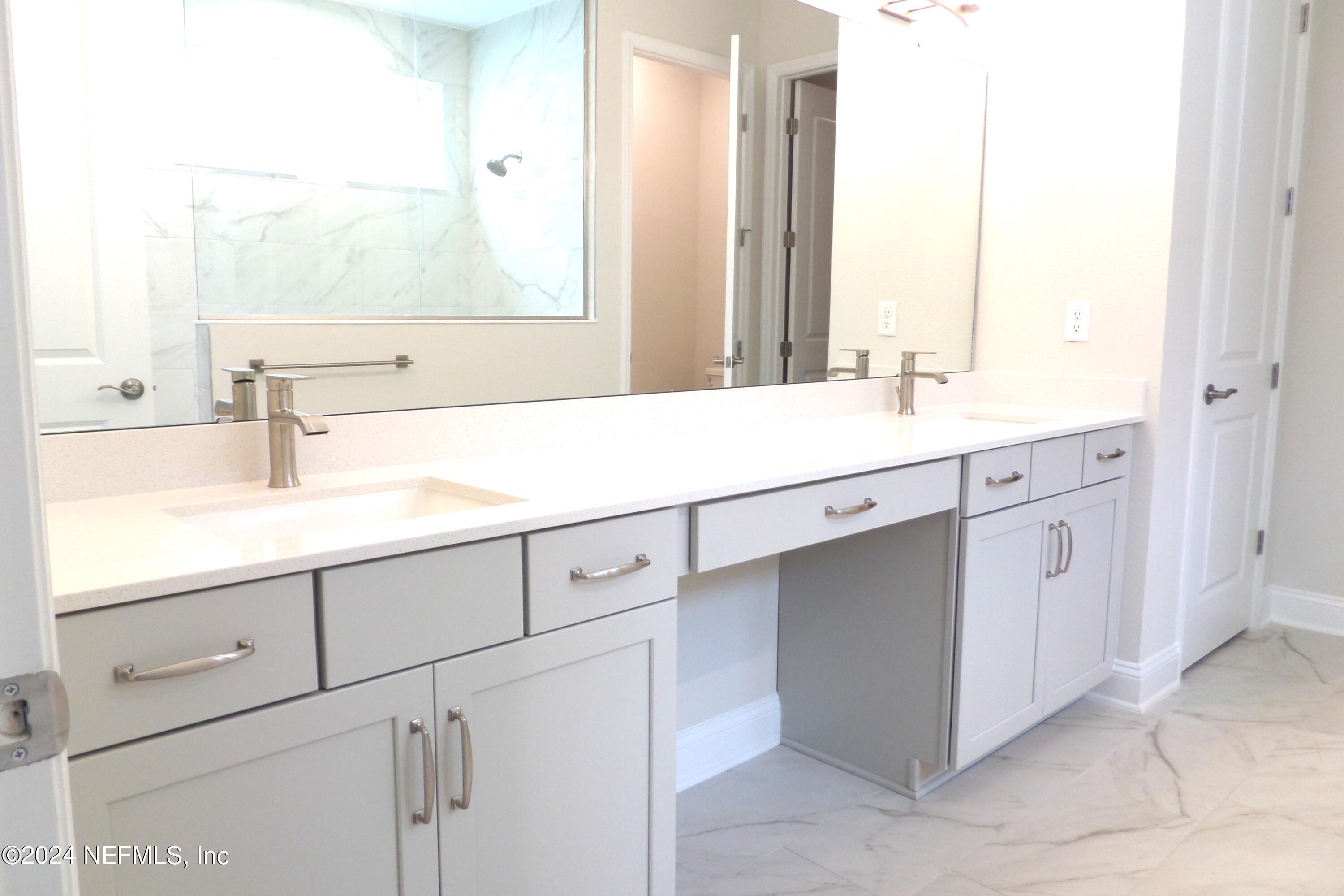 283 Pinellas Way St. Johns, FL 32259 - Photo 18 of 71 a bathroom with a sink and a mirror