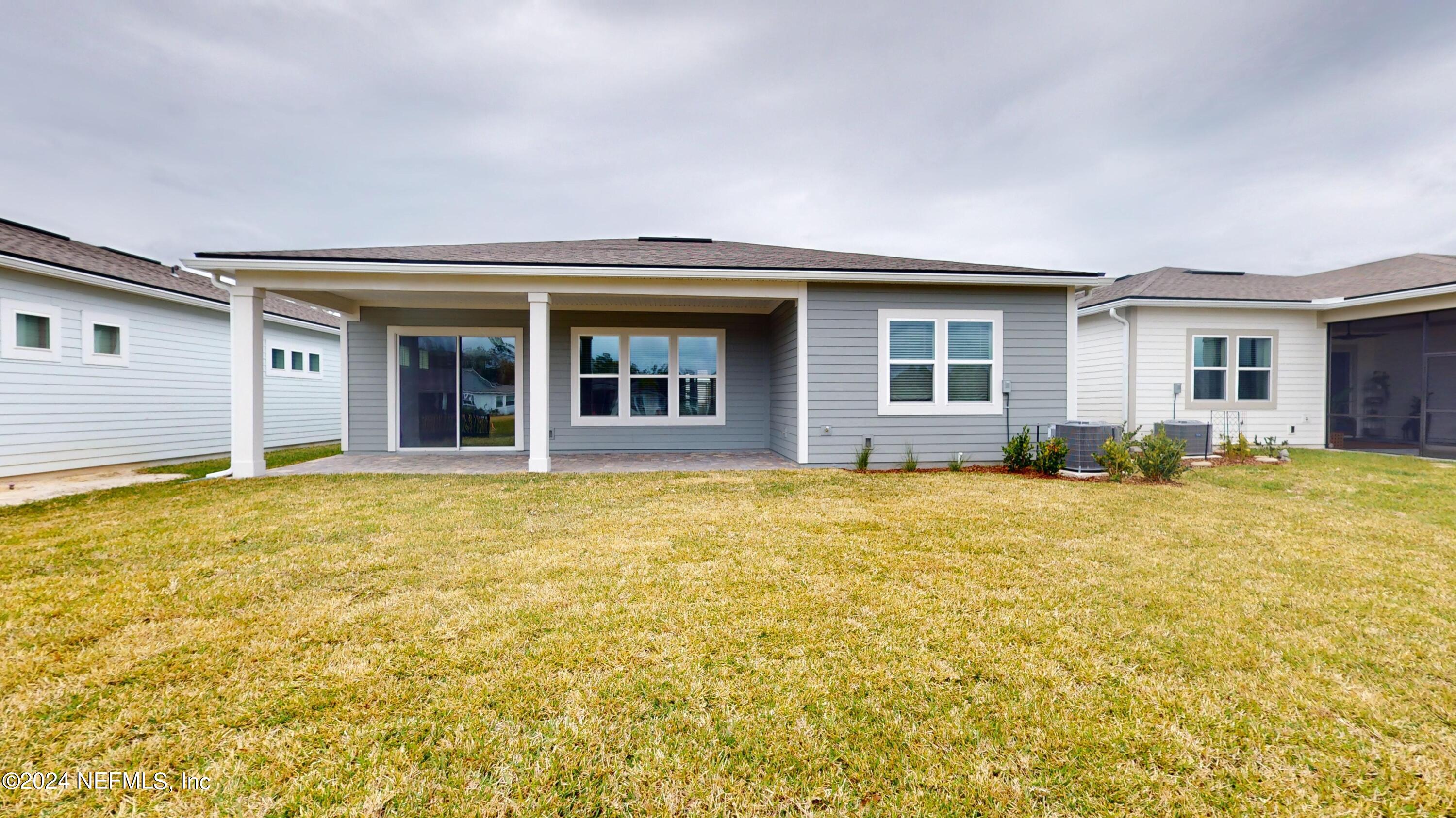 283 Pinellas Way St. Johns, FL 32259 - Photo 20 of 71 a view of a house with a backyard and windows