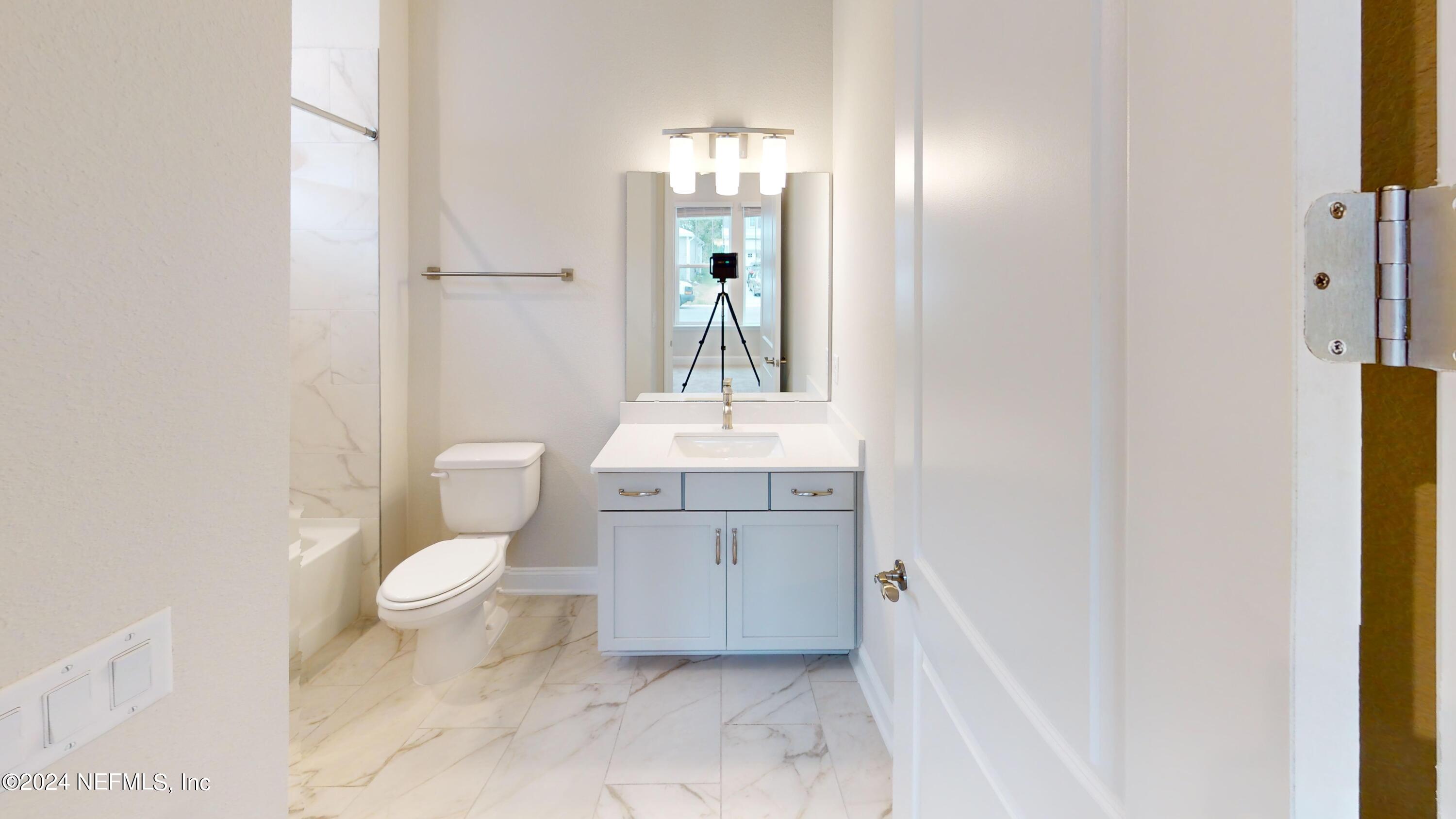 283 Pinellas Way St. Johns, FL 32259 - Photo 5 of 71 a bathroom with a sink and a mirror