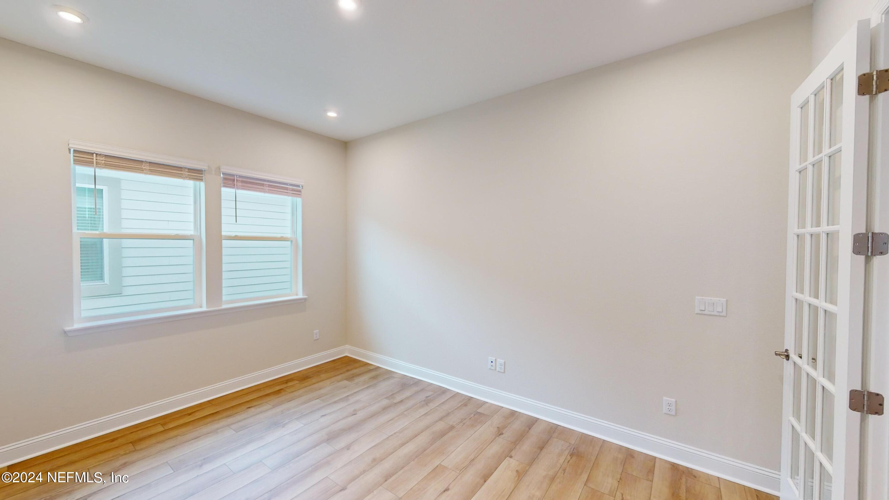 283 Pinellas Way St. Johns, FL 32259 - Photo 7 of 71 a view of empty room with wooden floor and fan
