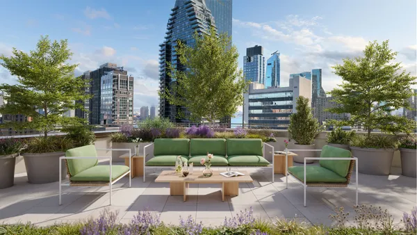 a view of a patio with couches table and chairs and potted plants
