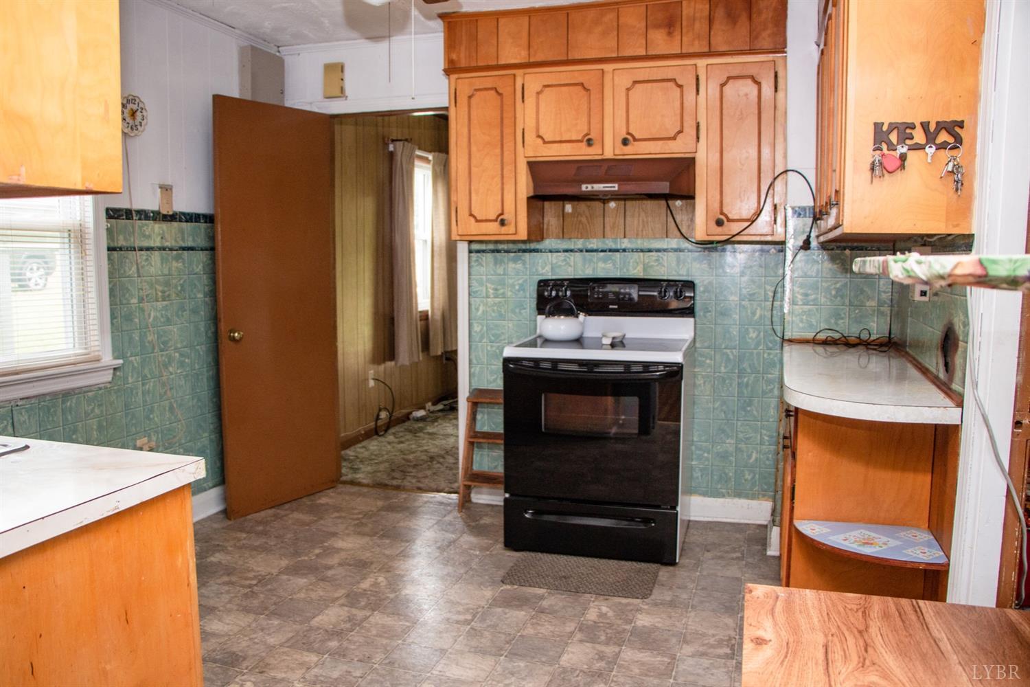 296 Pamplin Road Pamplin, VA 23958 - Photo 8 of 23 a kitchen with stainless steel appliances granite countertop a refrigerator and a stove