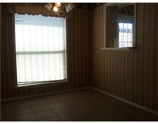 6702 Everhart Road, Unit W103 Corpus Christi, TX 78413 - Photo 3 of 4 a view of an empty room and window