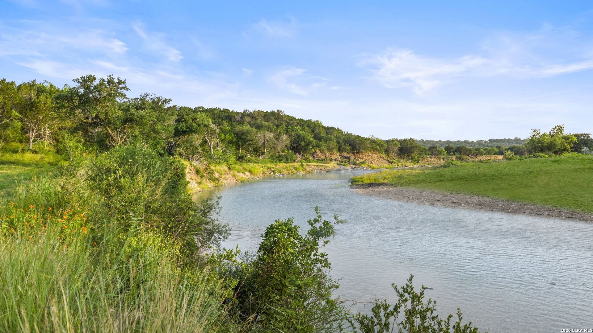 3402 Mormon Mill Road Marble Falls, TX 78654 - Photo 23 of 29 a view of a lake with houses in the back
