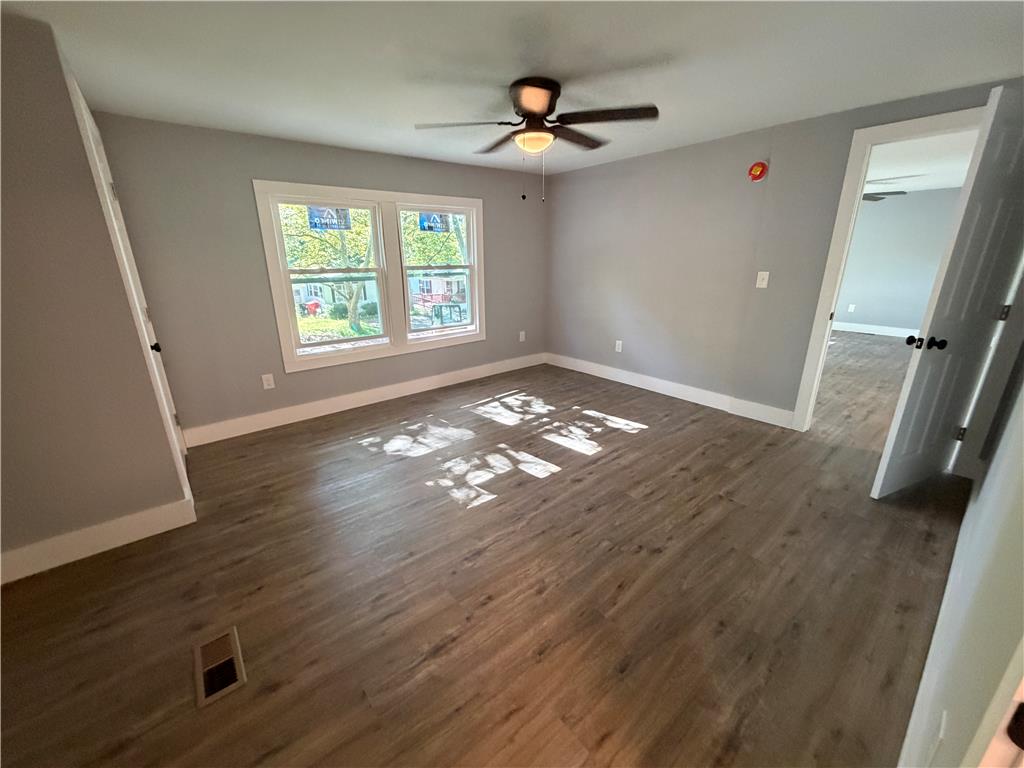 19 Springridge Road Bath, PA 18014 - Photo 17 of 29 Rich wood-look flooring and generous windows anchor this versatile bedroom space.