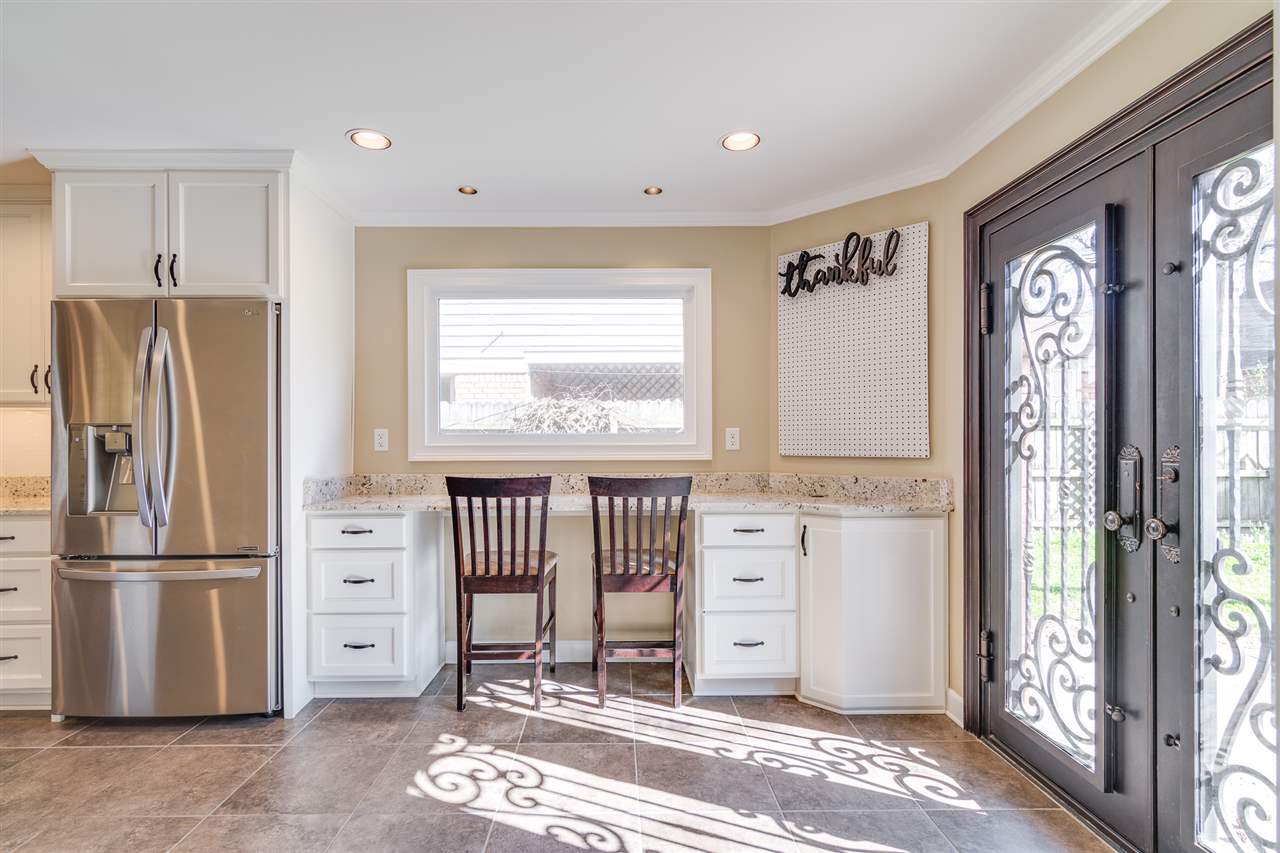 420 Meadvale Road Memphis, TN 38120 - Photo 4 of 25 Fantastic breakfast bar that doubles as a work space. Note the cabinet on the right which contains pullout drawers for printer & paper.