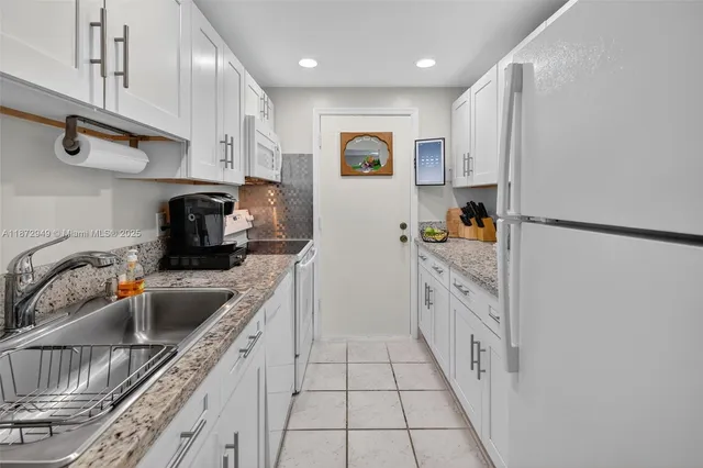 $129,000 | 2261 Northeast 67th Street, Unit 1806, Fort Lauderdale, FL 33308