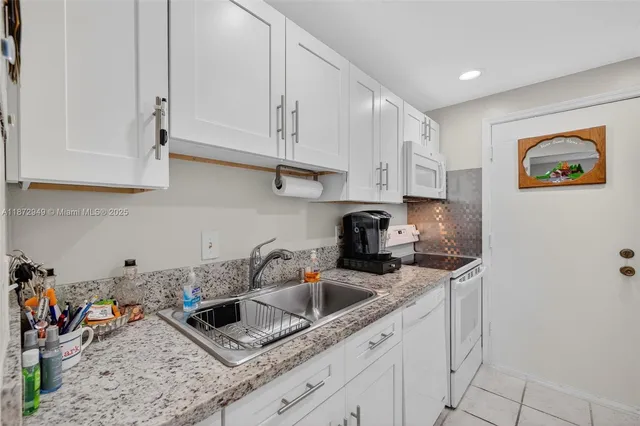 $129,000 | 2261 Northeast 67th Street, Unit 1806, Fort Lauderdale, FL 33308