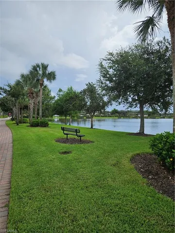 a view of a lake with houses in the back