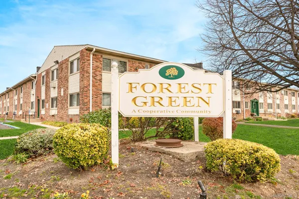 a sign board with a yard