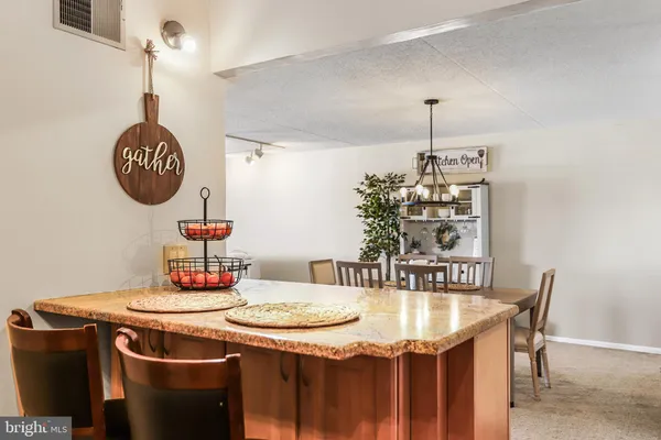 a table with a vase and a table with wooden floor