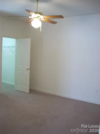 a view of a chandelier fan in a room