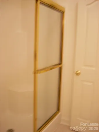 a room with a wooden floor and cabinets