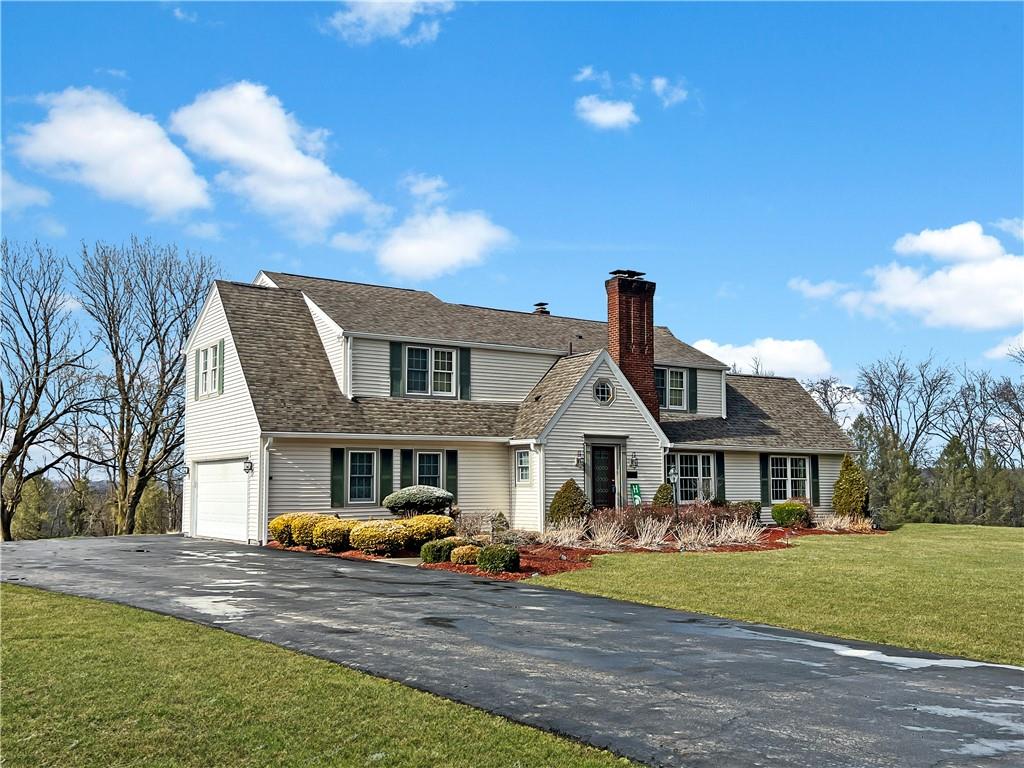 2045 Eastbrook Road New Castle, PA 16101 - Photo 1 of 23 a front view of a house with garden