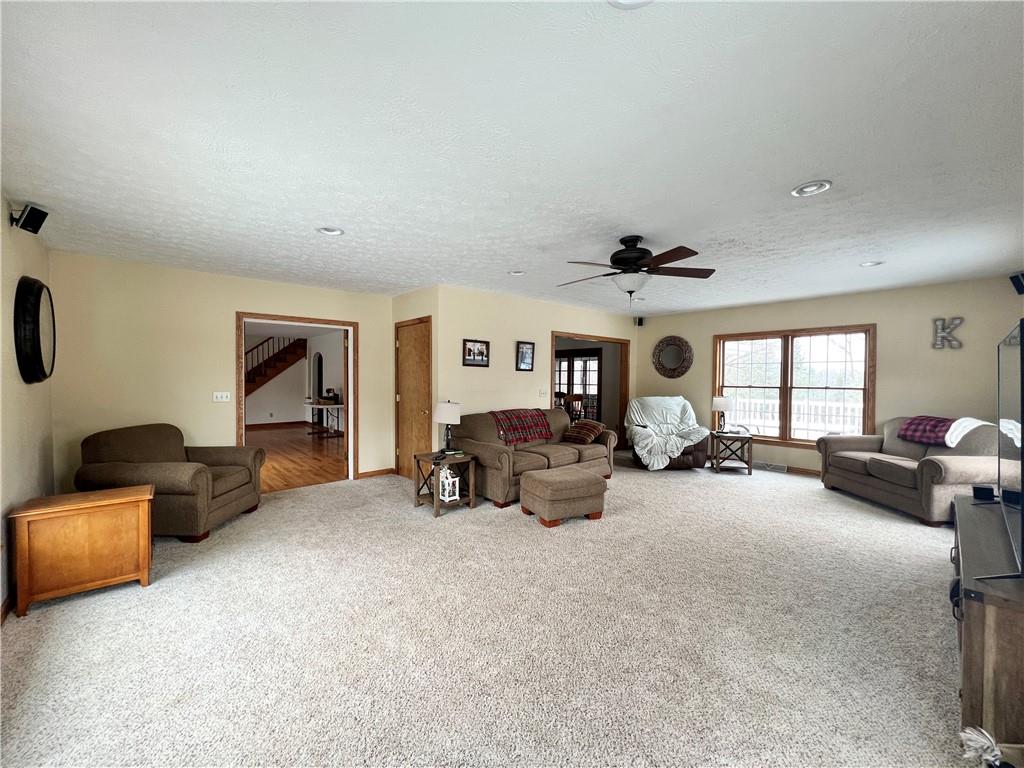 2045 Eastbrook Road New Castle, PA 16101 - Photo 5 of 23 a view of a livingroom with furniture and a ceiling fan