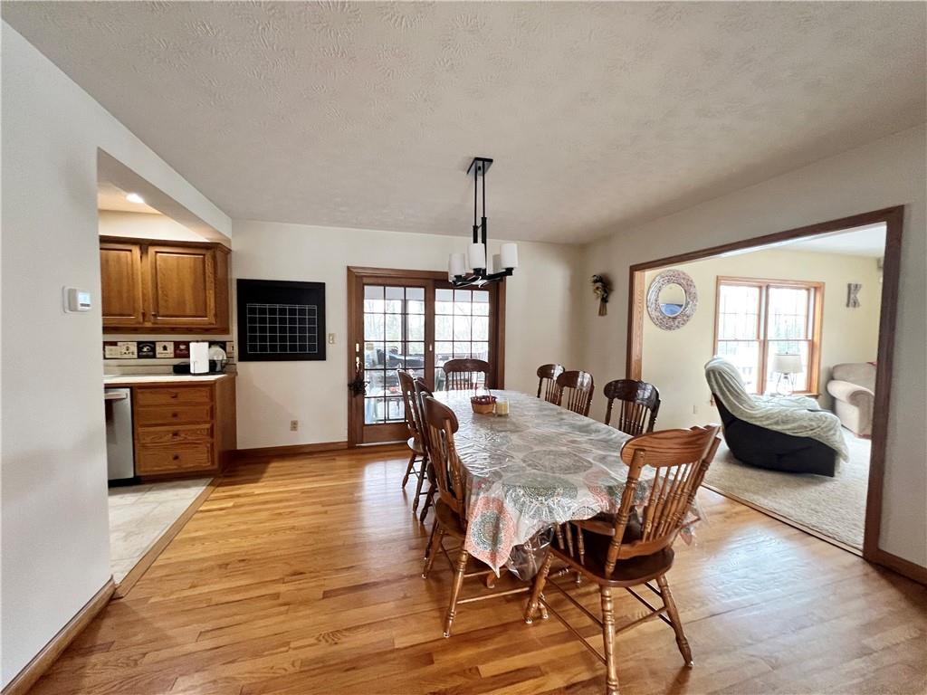 2045 Eastbrook Road New Castle, PA 16101 - Photo 6 of 23 a view of a dining room with furniture window and wooden floor