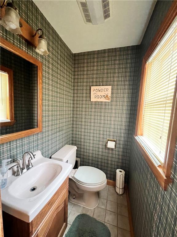 2045 Eastbrook Road New Castle, PA 16101 - Photo 10 of 23 a bathroom with a sink a toilet and mirror