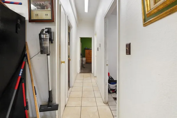 a view of walk in closet with clothes