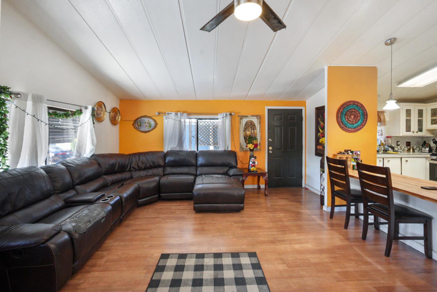 4837 Faith Home Road, Unit 102 Ceres, CA 95307 - Photo 6 of 16 a living room with furniture and a large window