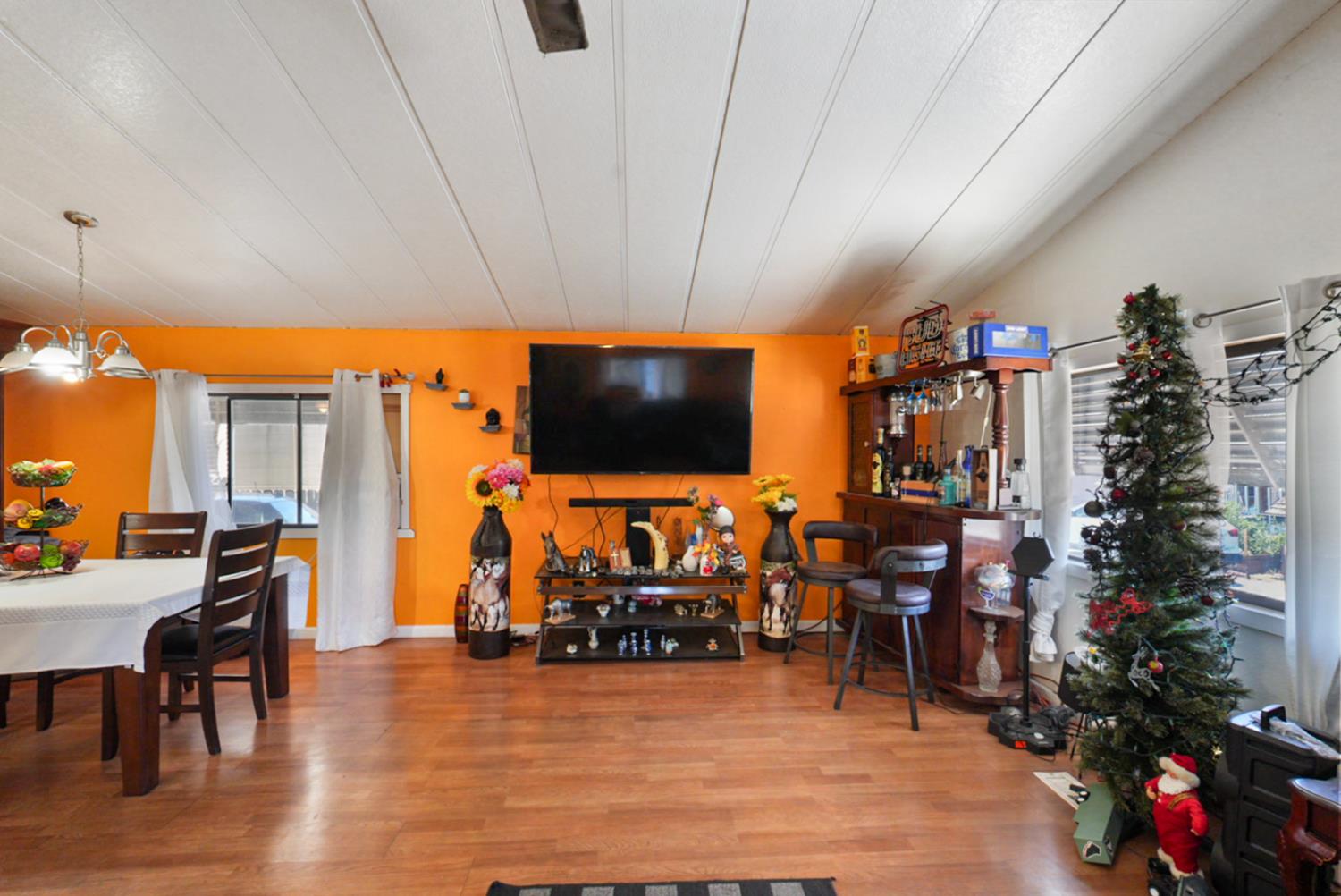 4837 Faith Home Road, Unit 102 Ceres, CA 95307 - Photo 9 of 16 a living room with furniture and a flat screen tv