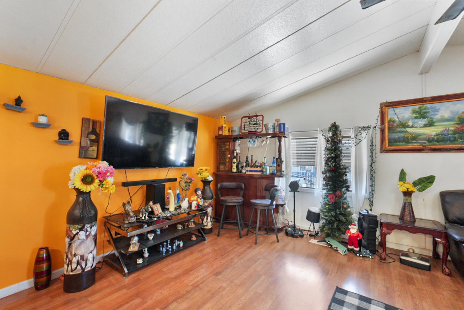 4837 Faith Home Road, Unit 102 Ceres, CA 95307 - Photo 10 of 16 a living room with furniture and a flat screen tv