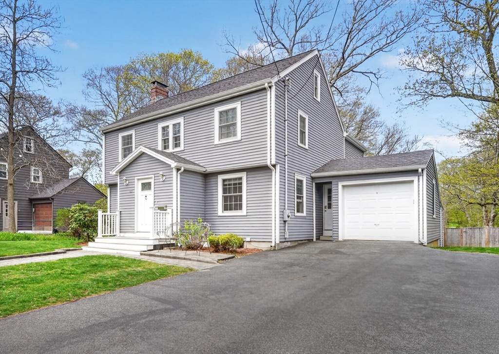 87 Payson Road Brookline, MA 02467 - Photo 2 of 41 front view of a house with a yard