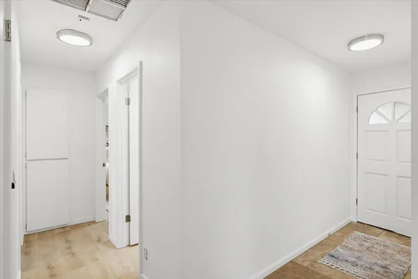 a bedroom with a bed couch and a window
