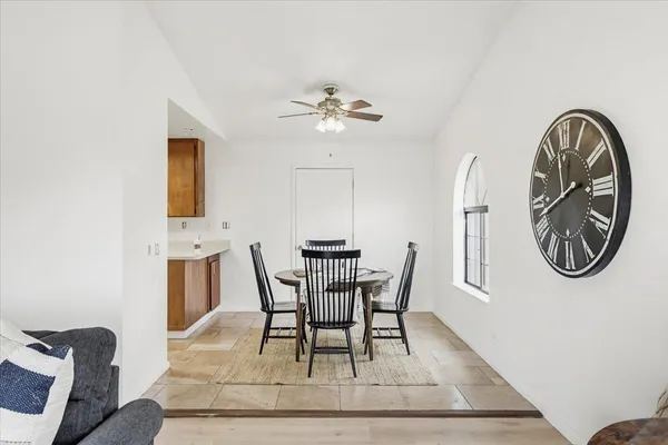 a dining room with furniture and window