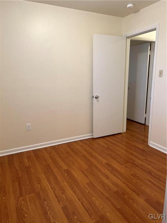1538 East 8th Street, Unit C Bethlehem, PA 18015 - Photo 14 of 18 a view of an empty room with wooden floor and closet