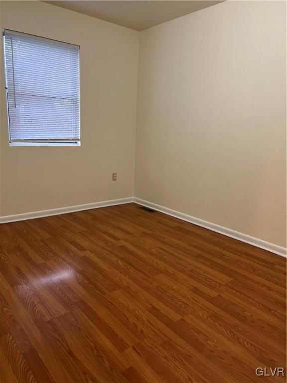 1538 East 8th Street, Unit C Bethlehem, PA 18015 - Photo 15 of 18 an empty room with wooden floor and windows