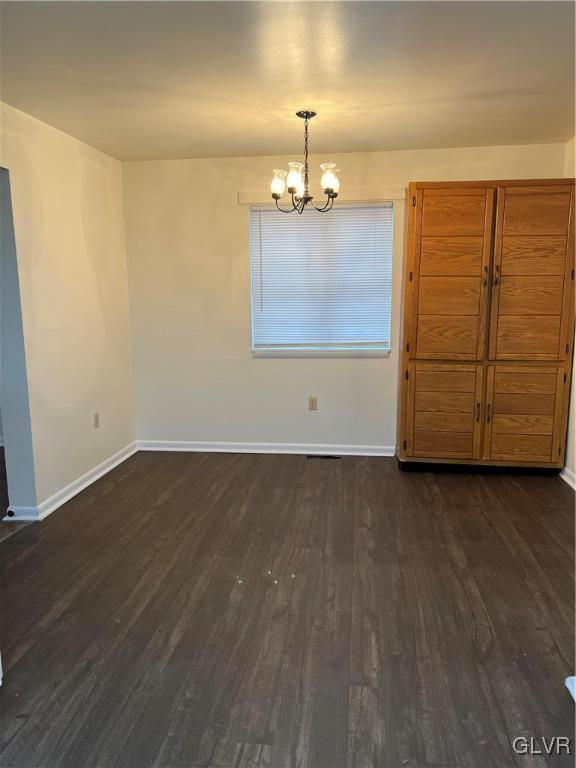 1538 East 8th Street, Unit C Bethlehem, PA 18015 - Photo 6 of 18 an empty room with wooden floor cabinet and windows